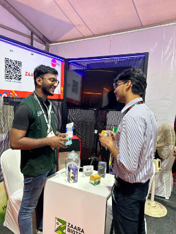 Two people networking at a booth